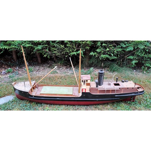 1295 - A vintage remote controlled boat with masts. 60cm h x 130cm w x 23cm d.