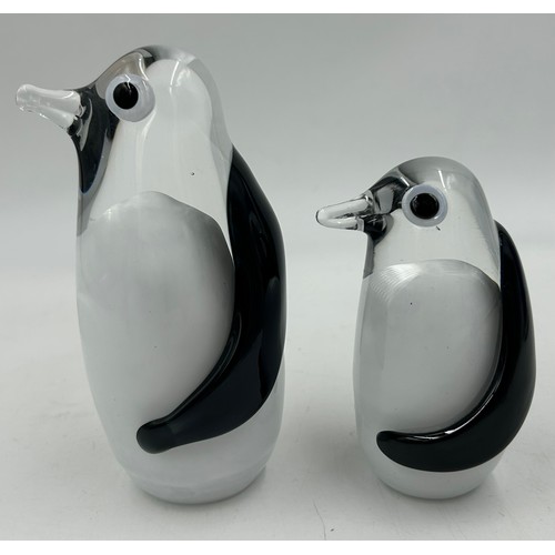 493 - Various continental glass to include two Svaja penguins, a black cylindrical vase with indistinct si... 