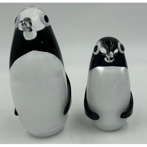 493 - Various continental glass to include two Svaja penguins, a black cylindrical vase with indistinct si... 