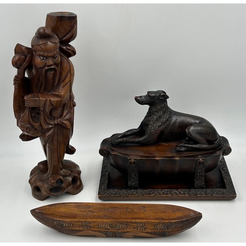 1333 - Three wooden carved items comprising a dog inkwell 20cm h, base 27.5 x 16.5cm, an Oriental figure ca... 