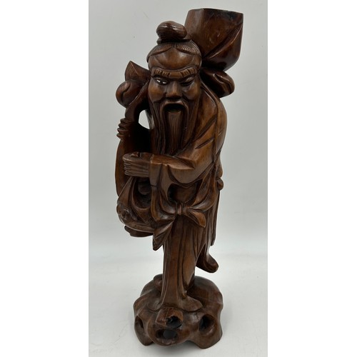 1333 - Three wooden carved items comprising a dog inkwell 20cm h, base 27.5 x 16.5cm, an Oriental figure ca... 