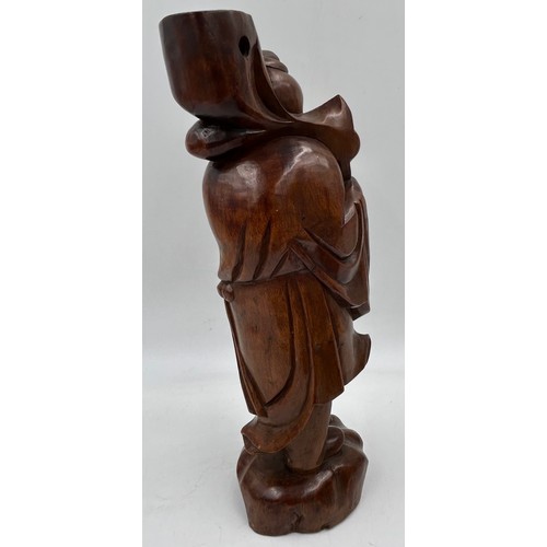 1333 - Three wooden carved items comprising a dog inkwell 20cm h, base 27.5 x 16.5cm, an Oriental figure ca... 