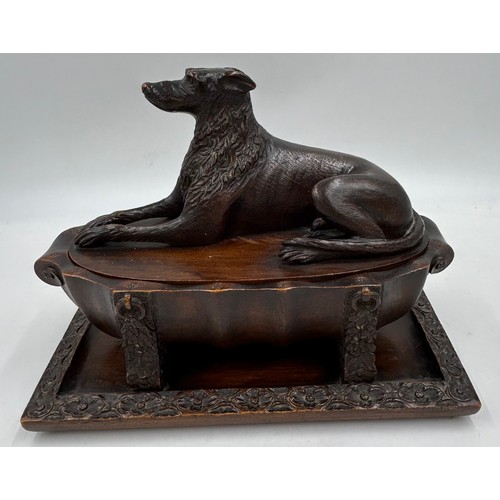 1333 - Three wooden carved items comprising a dog inkwell 20cm h, base 27.5 x 16.5cm, an Oriental figure ca... 