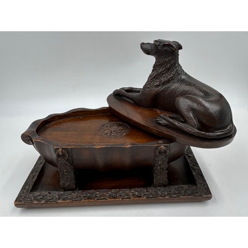 1333 - Three wooden carved items comprising a dog inkwell 20cm h, base 27.5 x 16.5cm, an Oriental figure ca... 