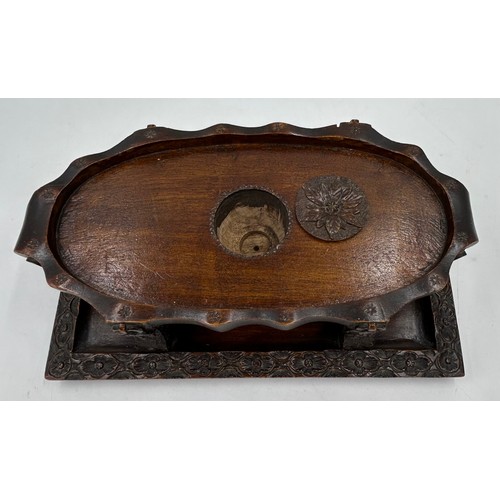 1333 - Three wooden carved items comprising a dog inkwell 20cm h, base 27.5 x 16.5cm, an Oriental figure ca... 