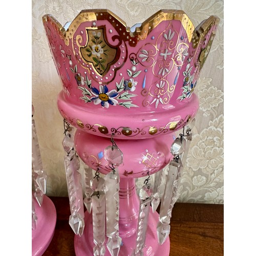 485 - A pair of 19thC pink glass lustres with gilt and enamel decoration. 36.5cm h x 16.5cm d. Together wi... 