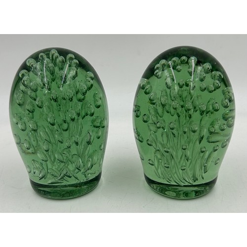 486 - A set of three Victorian glass dumps with bubble inclusions. Tallest 18cm, others 13cm.