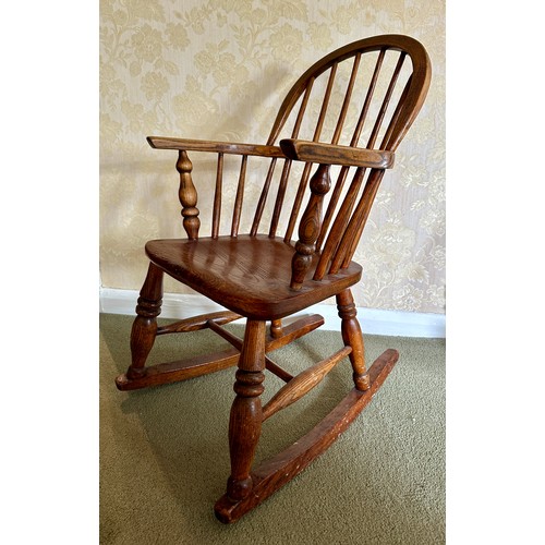 85 - Child’s windsor rocking armchair in ash and elm. Height to back 74cm 45.5cm w x height to seat 34cm.