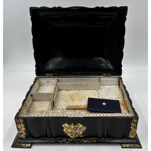 1386 - Two boxes : a papier-mâché sewing/jewellery box with gilt and mother of pearl embellishment raised o... 