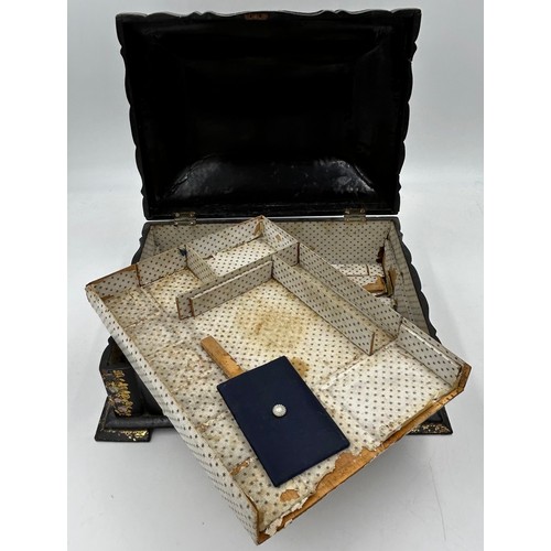 1386 - Two boxes : a papier-mâché sewing/jewellery box with gilt and mother of pearl embellishment raised o... 