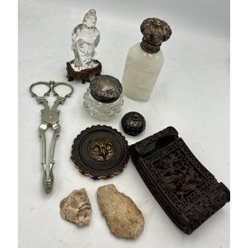 1391 - A miscellany to include 19thC white glass scent bottle, owl pin cushion, sugar nips, silver topped g... 