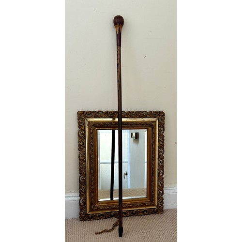 1394 - A 19thC marquetry topped cane 95cm together with a bevelled, gilt framed wall mirror 52 x 41.5cm.