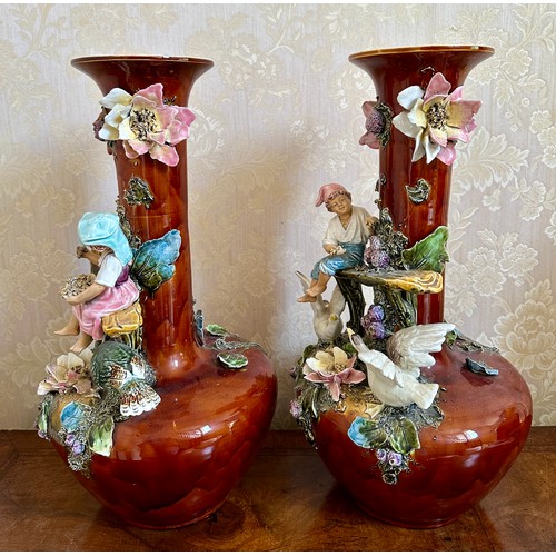 367 - A pair of 19thC continental vases with children, flowers and birds. 53cm h.