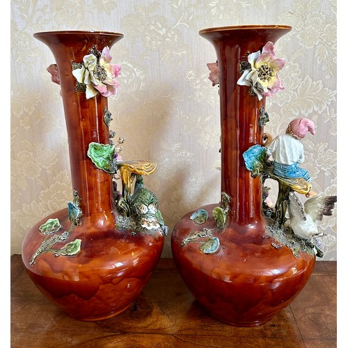 367 - A pair of 19thC continental vases with children, flowers and birds. 53cm h.