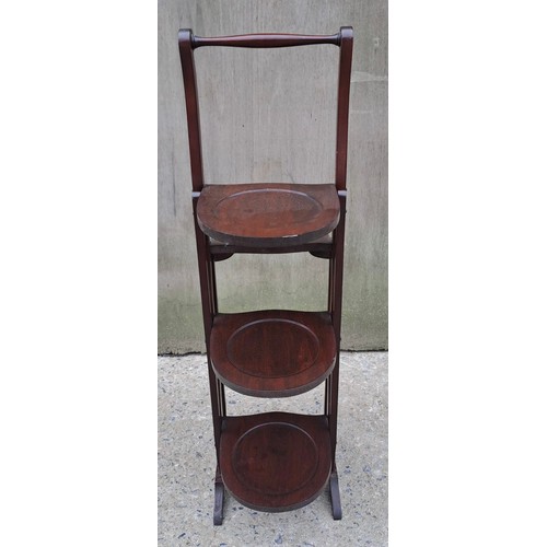 72 - An Edwardian mahogany double folding cake stand. 90cm h x 26cm w x 25cm d.