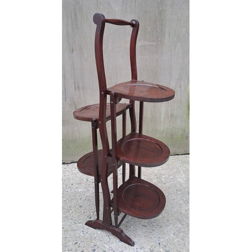 72 - An Edwardian mahogany double folding cake stand. 90cm h x 26cm w x 25cm d.