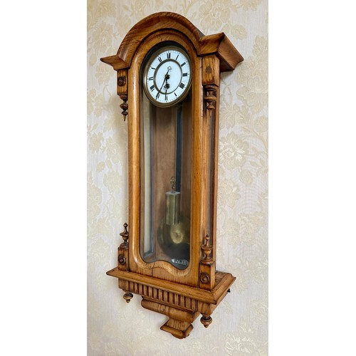 1121 - A 19thC single weight Vienna wall clock. 78cm h x 30cm w. Pendulum, weight and key.