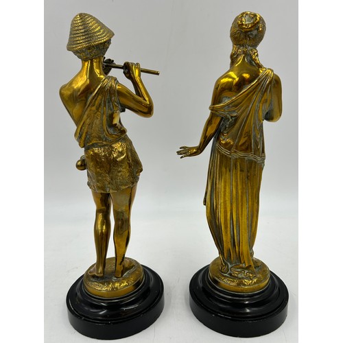 1079 - A pair of cast brass classical figures on circular marble plinths. 30.5cm h. Both signed 'Richard'.