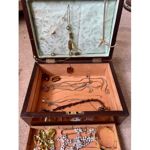 517 - A 19thC rosewood box containing costume jewellery to include jet earrings and brooch, necklaces etc.