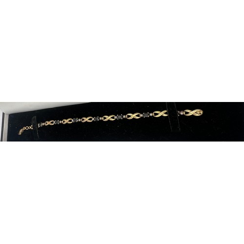 649 - Nine carat gold bracelet set with sapphire and diamonds. Length 17.5cm. Weight 5.5gm.