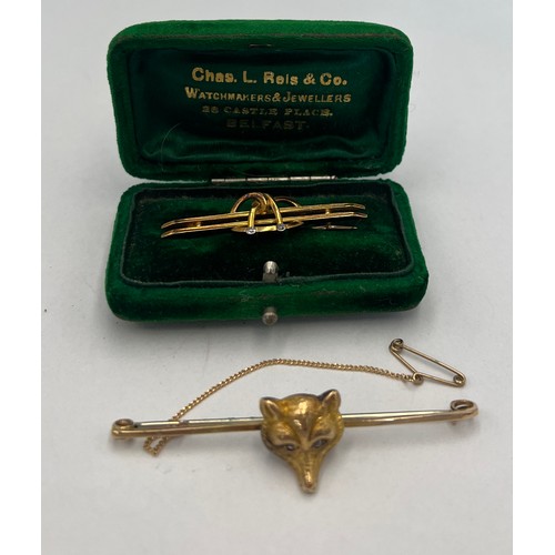 651 - Two 15 carat gold bar brooches to include fox mask, both set with clear stones. Total weight 6.6gm.