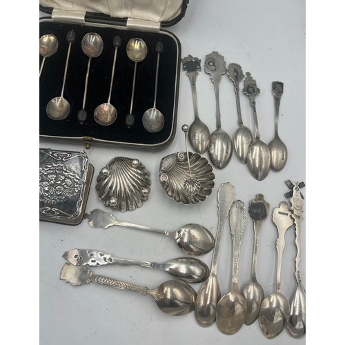 911 - Silver and plated items to include boxed silver coffee bean spoons, two shell shaped salts with one ... 