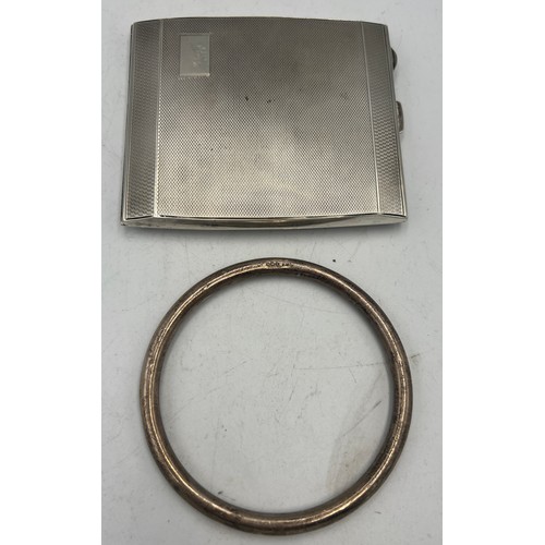 912 - Silver cigarette case Birmingham 1946, together with a silver bangle Birmingham 1922. Total weight 1... 