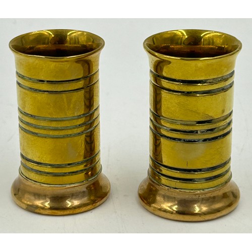 1077 - Brass items to include a pair of chambersticks with dog handles 13cm h, 2 pairs of trench art candle... 