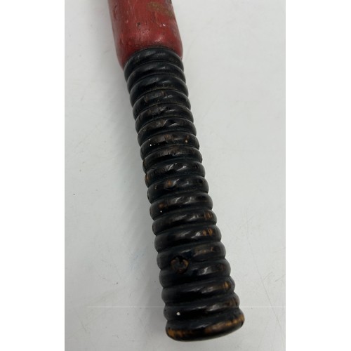 1337 - A Victorian police hardwood truncheon with painted Victorian Crown, lettering 'V R', and turned hand... 