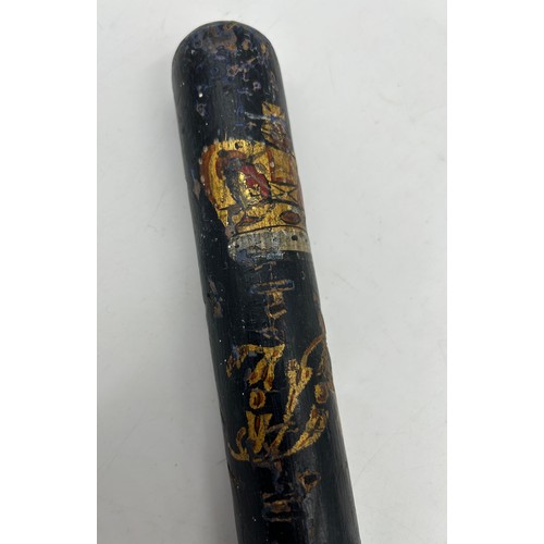 1337 - A Victorian police hardwood truncheon with painted Victorian Crown, lettering 'V R', and turned hand... 