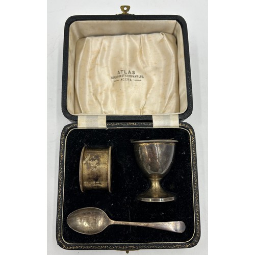 904 - A hallmarked cased silver christening set consisting of egg cup, spoon and napkin ring, Adie Brother... 