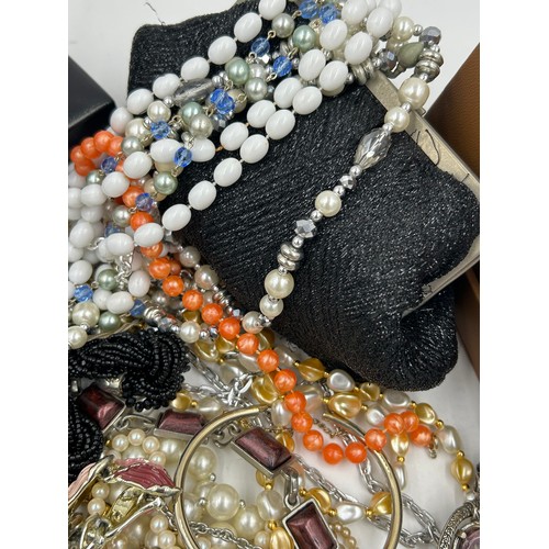 516 - A quantity of costume jewellery to include  brooches, earrings, necklaces, a Michael Kors watch with... 