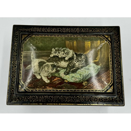 1335 - A vintage tin decorated with playful cats with oval mirror to inner lid. 28.5 l x 20 w x 11cm h.