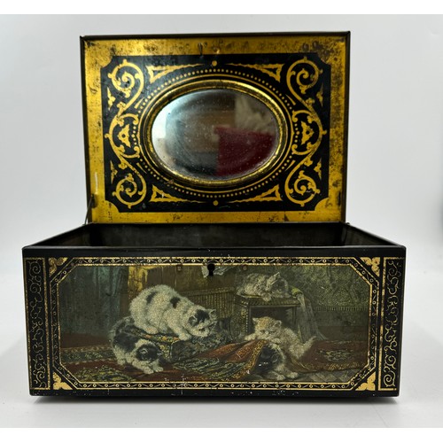 1335 - A vintage tin decorated with playful cats with oval mirror to inner lid. 28.5 l x 20 w x 11cm h.