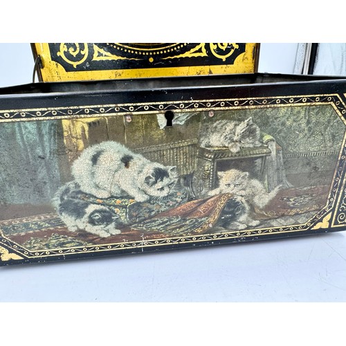 1335 - A vintage tin decorated with playful cats with oval mirror to inner lid. 28.5 l x 20 w x 11cm h.