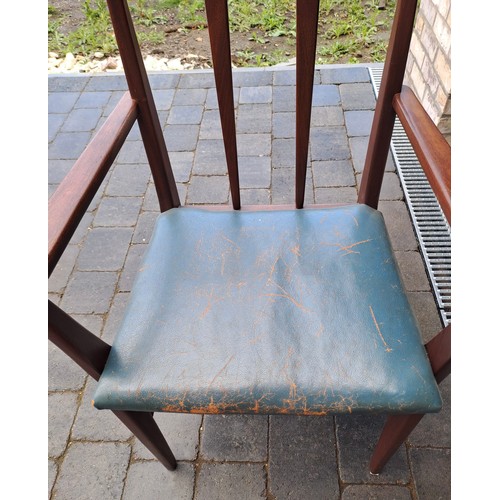 98 - A mid 20thC teak extending dining table and six chairs including two with arms. Table size open 69cm... 