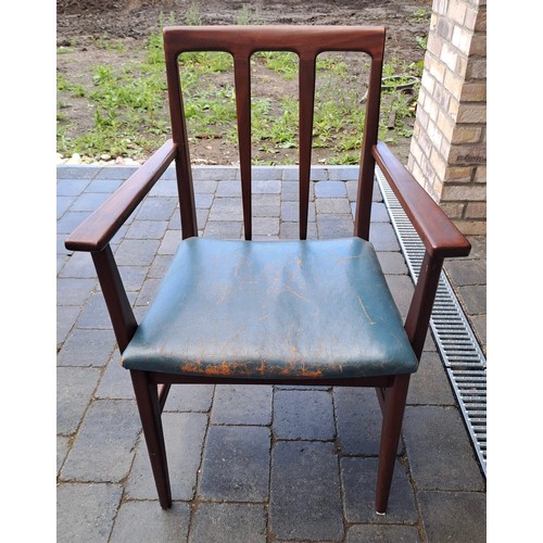 98 - A mid 20thC teak extending dining table and six chairs including two with arms. Table size open 69cm... 