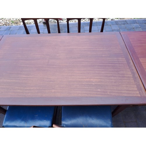 98 - A mid 20thC teak extending dining table and six chairs including two with arms. Table size open 69cm... 