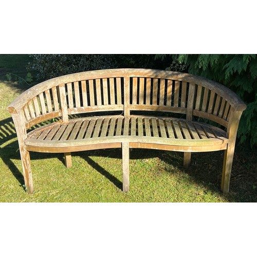 9 - Two serpentine fronted teak garden benches. 153cm w x 56cm d x 80cm h.