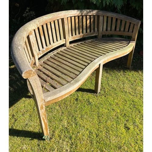 9 - Two serpentine fronted teak garden benches. 153cm w x 56cm d x 80cm h.