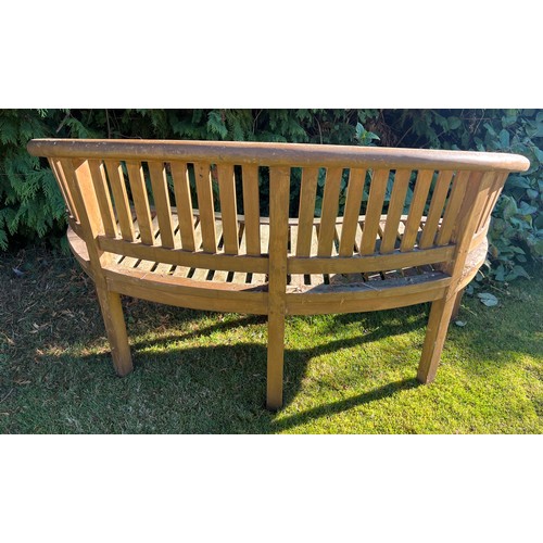 9 - Two serpentine fronted teak garden benches. 153cm w x 56cm d x 80cm h.