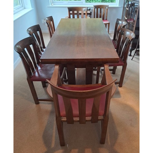 103 - An early 20thC Arts and crafts style dining table with eight chairs. 76cm h x 168cm l (closed) 260cm... 