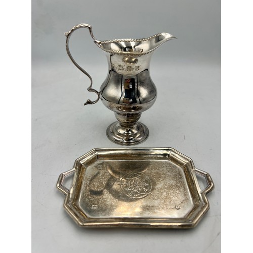 908 - Silver cream jug London 1970, and a small dish with Yorkshire rose Sheffield 1971. Total weight 139g... 