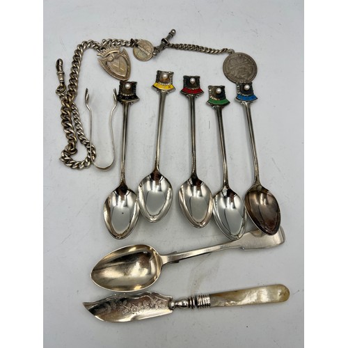 909 - Silver to include sterling silver and enamel NHK spoons x 5, sugar tongs, butter knife, watch chain ... 