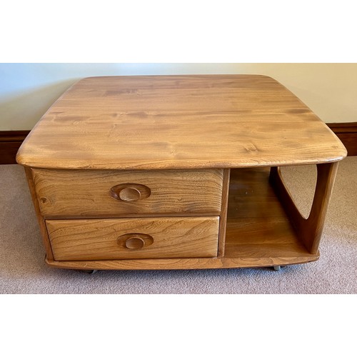 106 - Ercol coffee table with two drawers on wheels. 80cm x 80cm x 39cm h.