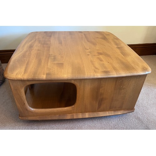 106 - Ercol coffee table with two drawers on wheels. 80cm x 80cm x 39cm h.