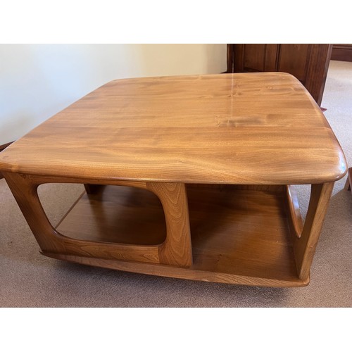 106 - Ercol coffee table with two drawers on wheels. 80cm x 80cm x 39cm h.