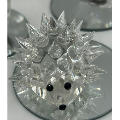 477 - A collection of Swarovski crystal animals etc. to include 2 x hedgehogs, owl, penguin, 3 x birds, 3 ... 