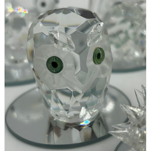 477 - A collection of Swarovski crystal animals etc. to include 2 x hedgehogs, owl, penguin, 3 x birds, 3 ... 