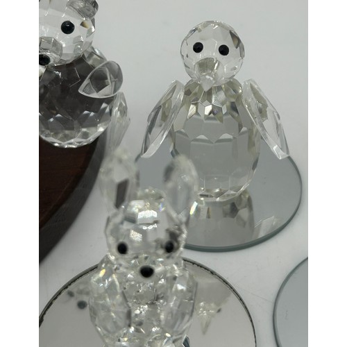 477 - A collection of Swarovski crystal animals etc. to include 2 x hedgehogs, owl, penguin, 3 x birds, 3 ... 